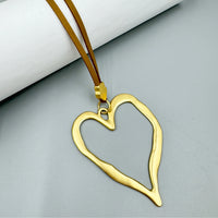 Open Heart Pendant Necklace - Silver with Black Cord, close-up