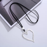 Open Heart Pendant Necklace - Silver with Black Cord, product shot